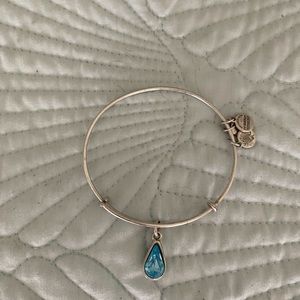 Alex and Ani silver metal adjustable bracelet with bright blue faux gem